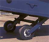 Strong Tubular Steel Box Undercarriage Assembly has 19 inch Solid Rubber Pneumatic Profile Tires for Easy Positioning.